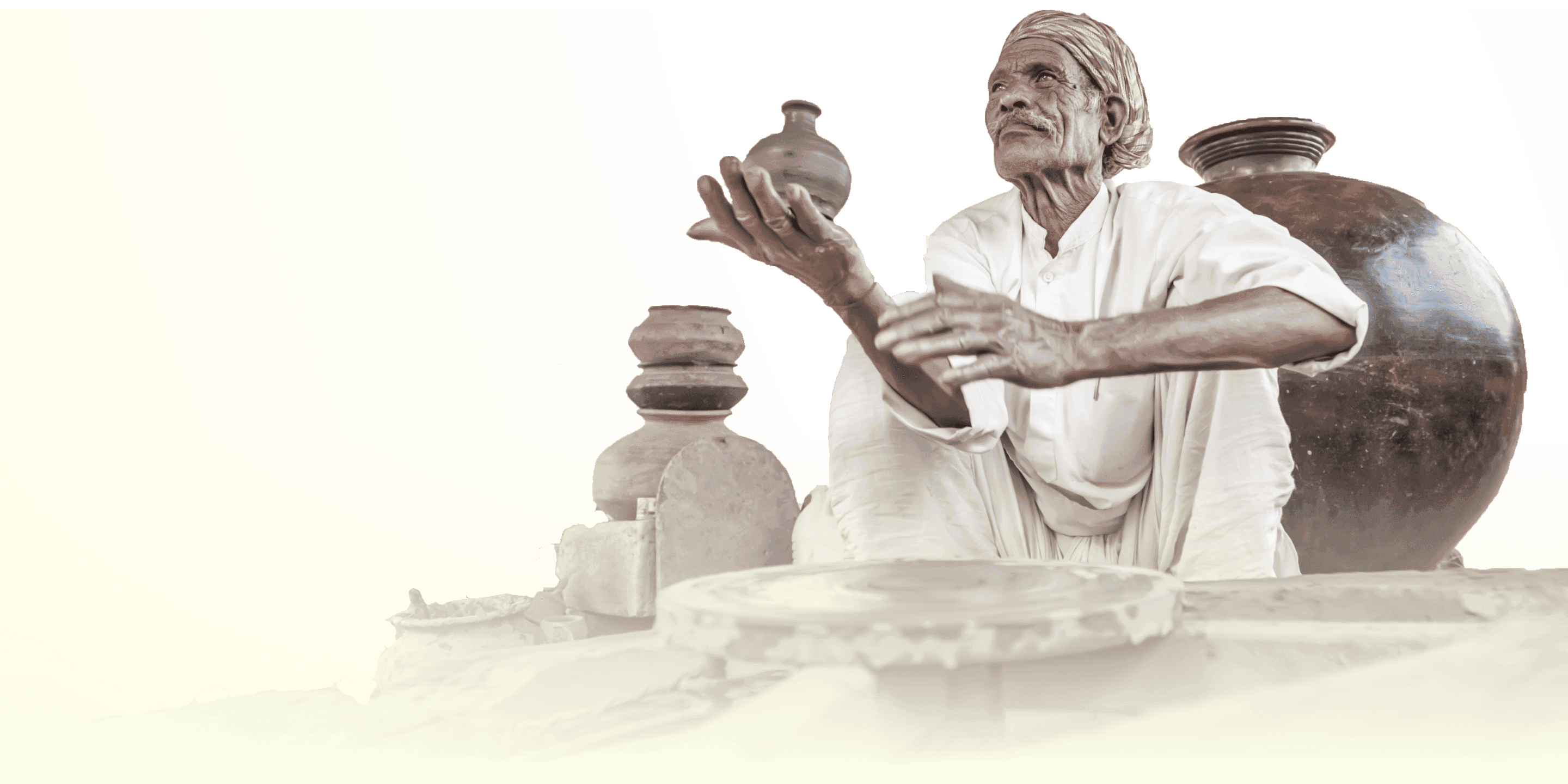 A Sri Lankan artisan presenting traditional pottery