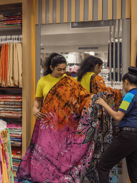 A customer receiving assistance in the Lady J textile department